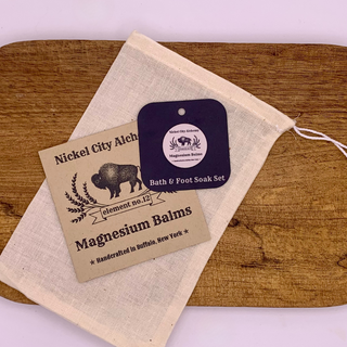 Nickel City Alchemy magnesium balms packaging in a muslin bag